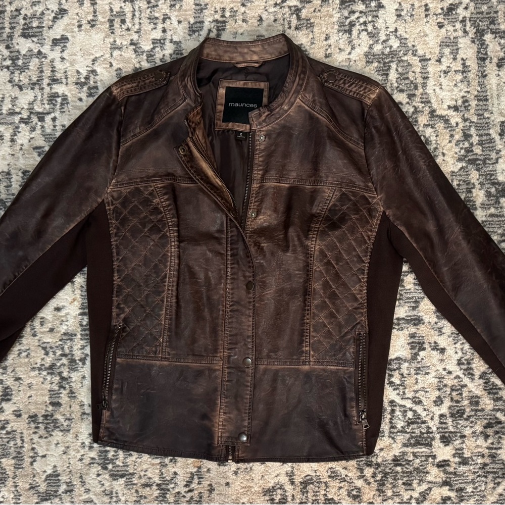 Maurice’s brown leather jacket